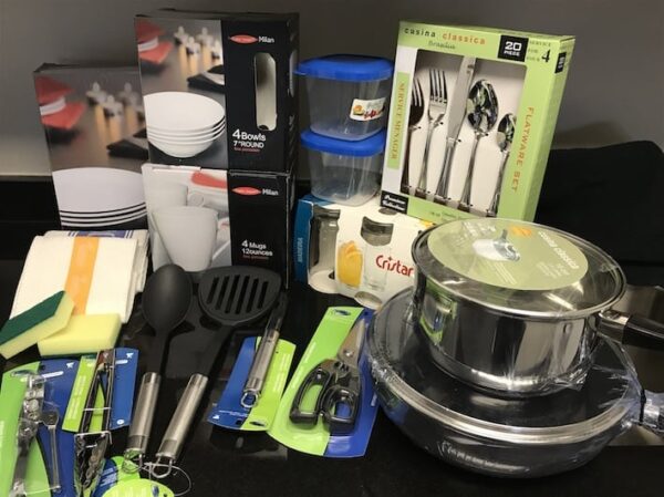 A table with many different types of kitchen utensils.