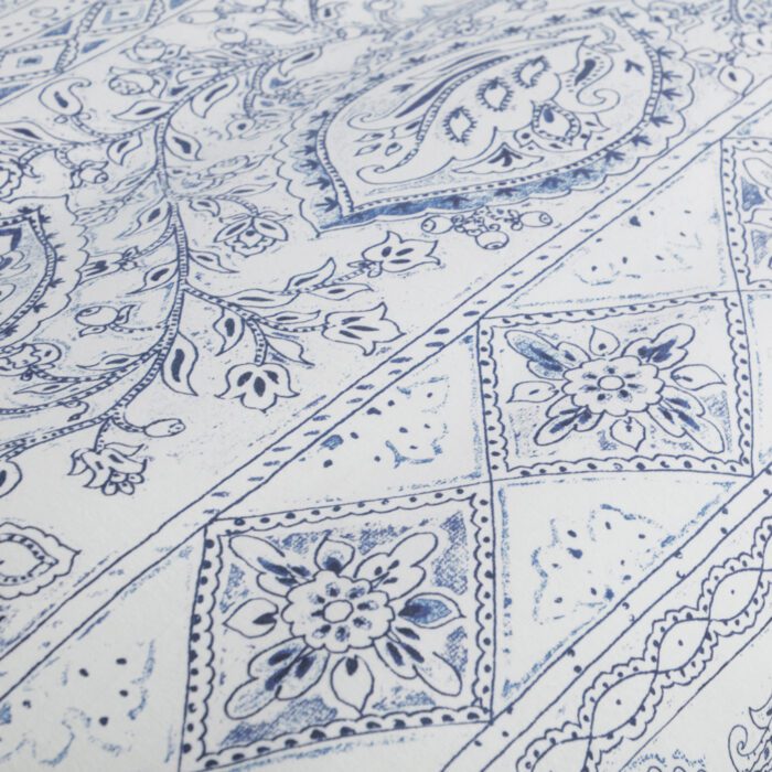 A close up of the blue and white pattern on a blanket