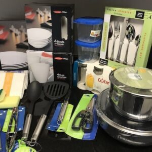 A table with many different types of kitchen utensils.