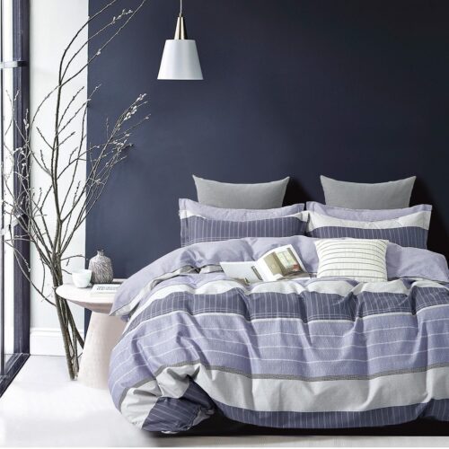 A bed with blue and white striped sheets