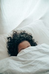 girl under covers