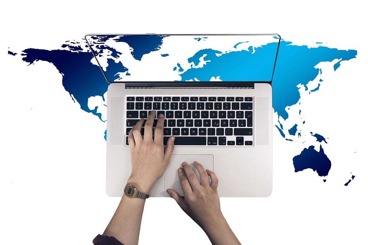 Laptop over world map